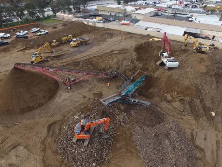 construction site with multiple excavators